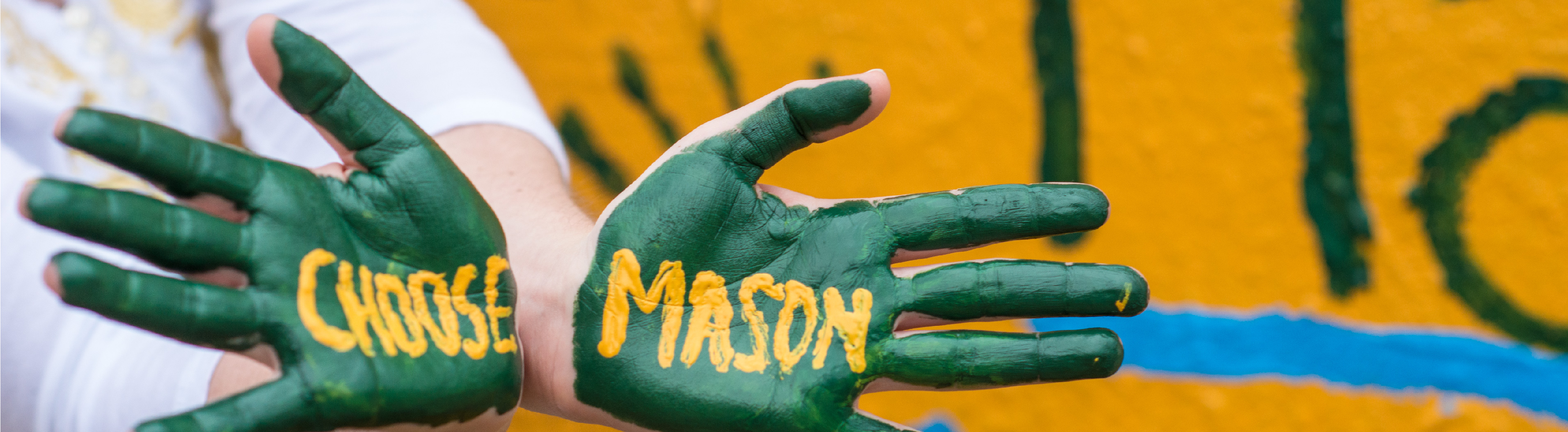 Hands painted with the words Choose Mason